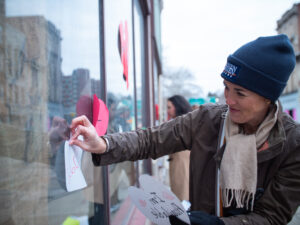 Volunteer Wheeling “Heart Bombs” The Friendly City for Valentine’s Day