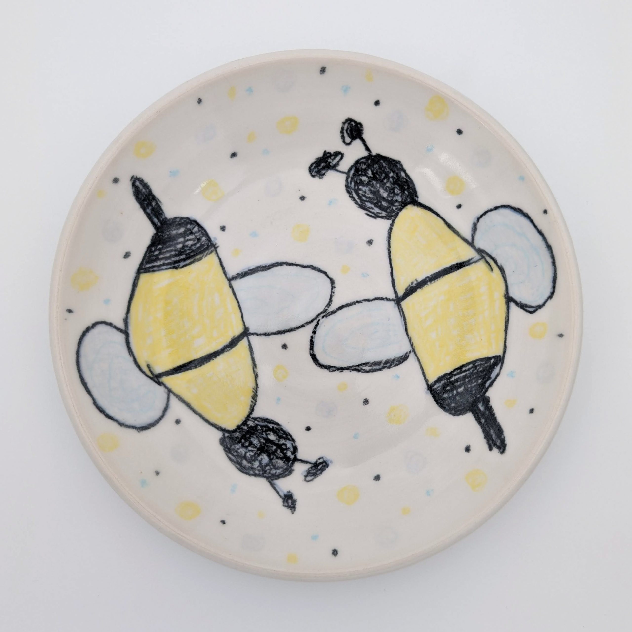 Ceramic, underglaze chalk, newsprint transfers, glaze