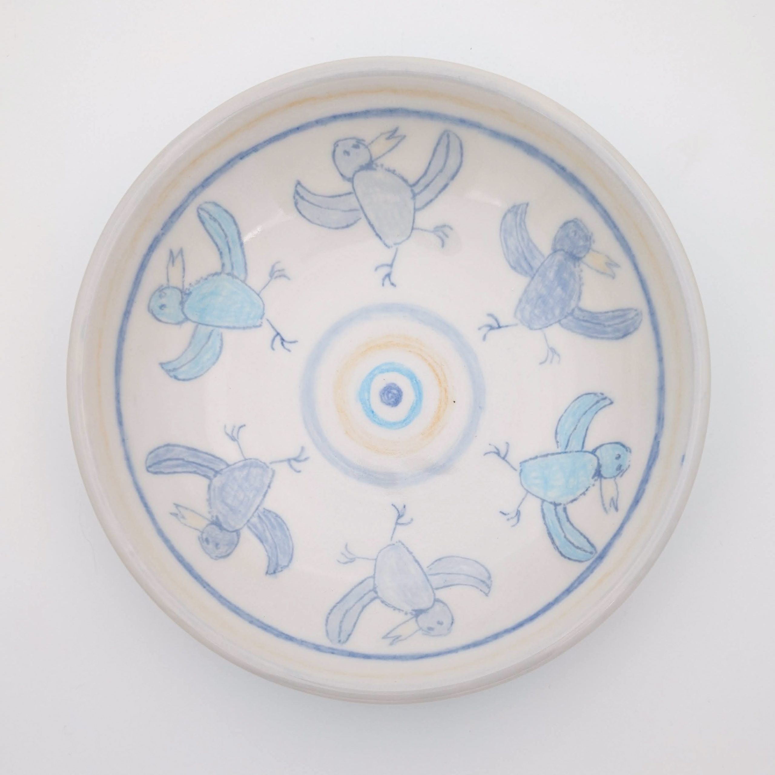 Ceramic, underglaze chalk, newsprint transfers, glaze