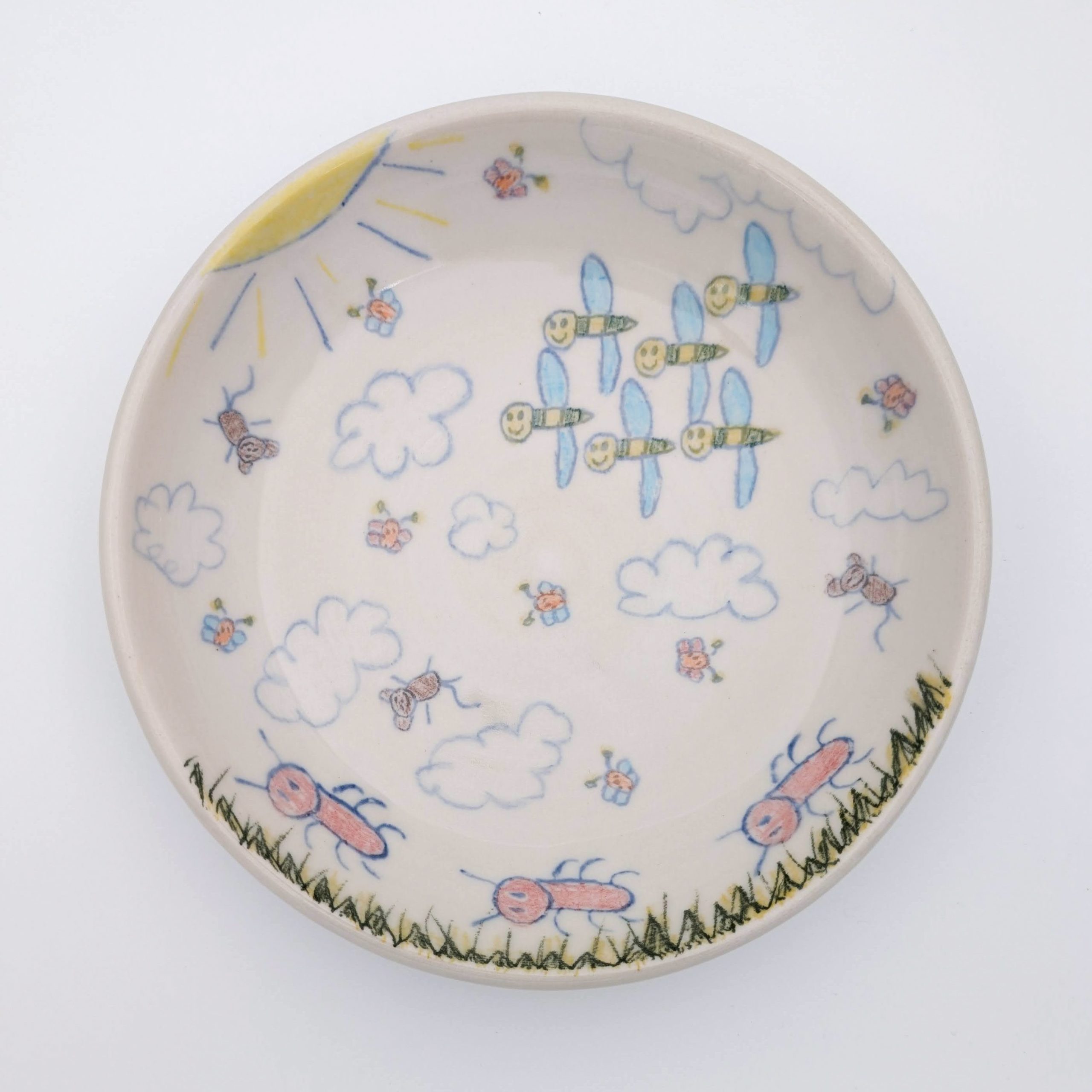 Ceramic, underglaze chalk, newsprint transfers, glaze