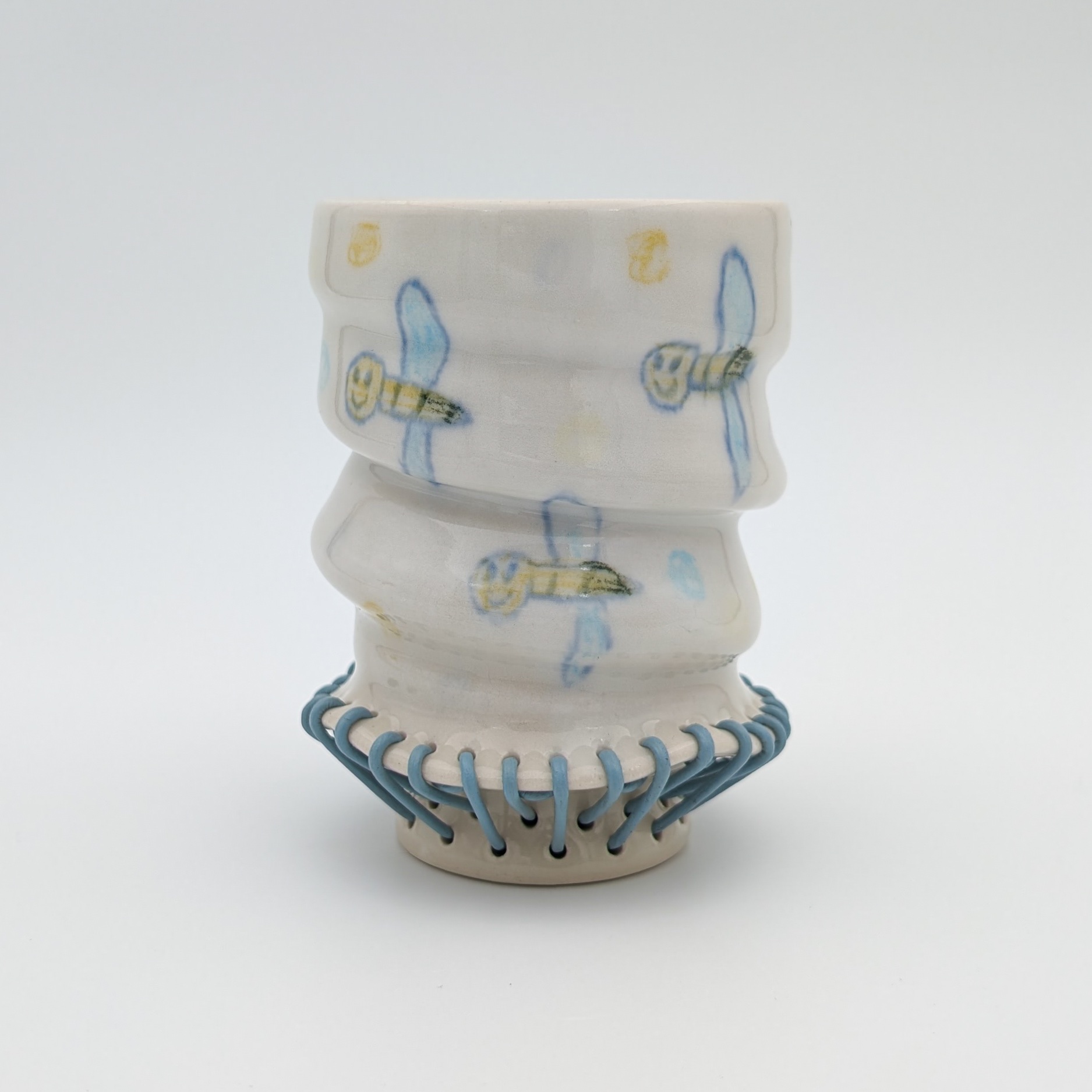 Ceramic, underglaze chalk, newsprint transfers, glaze